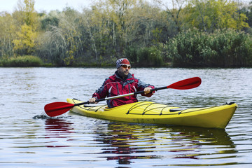 A trip by the river on a kayak.