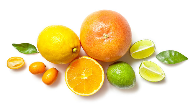 various citrus fruits on white background