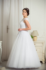 Fototapeta premium Beautiful bride before wedding ceremony in appartament