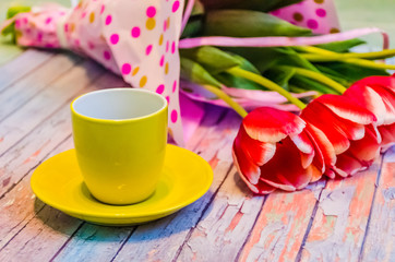Fototapeta na wymiar Still life with tulips on the wooden background