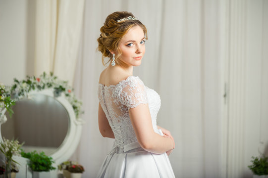 Beautiful bride before wedding ceremony in appartament