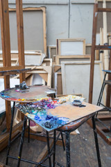 Oil Paints on Palettes and Art Materials in Studio