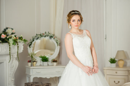 Beautiful bride before wedding ceremony in appartament