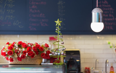Hot beverage in a red cup placed on a modern cafe table with warm ambiance.