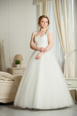 Fototapeta premium Beautiful bride before wedding ceremony in appartament