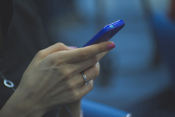 Business Woman conducts business correspondence on the phone for business meetings and negotiations on work.

