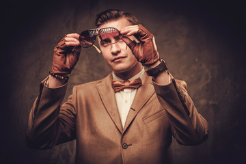 Sharp dressed man wearing jacket and bow tie
