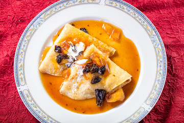 Tasty pancakes in sweet syrup as delicious dessert