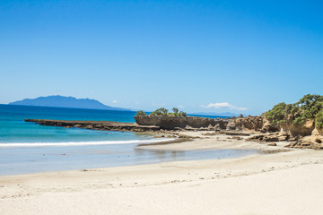 coastline with sand beach and rocks, sea background, new zealand nature
