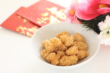 Chinese food, deep fried sesame seed ball with red pocket for new year food