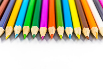 School supplies colored pencils in a row