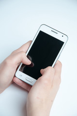 Girl holding a white smartphone. White background