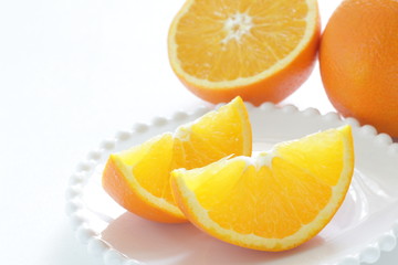 Fototapeta na wymiar Freshness Orange cut section on white background