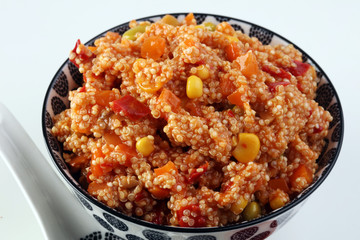 Delicious vegetarian quinoa salad with bell pepper, cucumber and tomatoes
