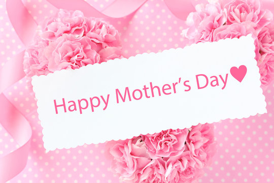 Happy mother's day card on Pink carnation bouquet with pink ribbon