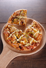Delicious tasty pizza with on wooden table