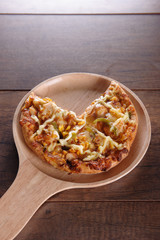 Delicious tasty pizza with on wooden table