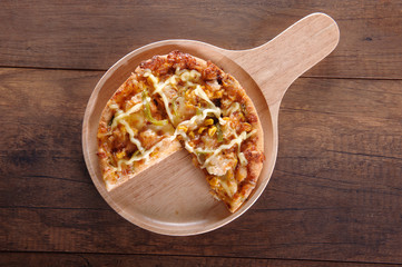 Delicious tasty pizza with on wooden table