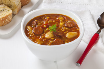 Spanish Chorizo Soup, with red lentils, tomatoes and butter beans, served with garlic bread.