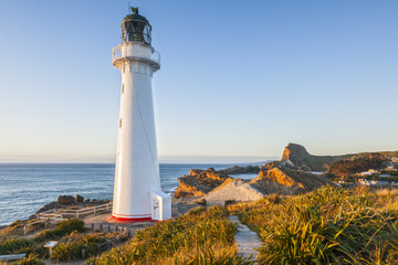 Castlepoint Lighthouse, Wairarapa, New Zealand, at sunrise.