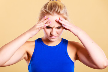 fitness woman with headache migraine pain