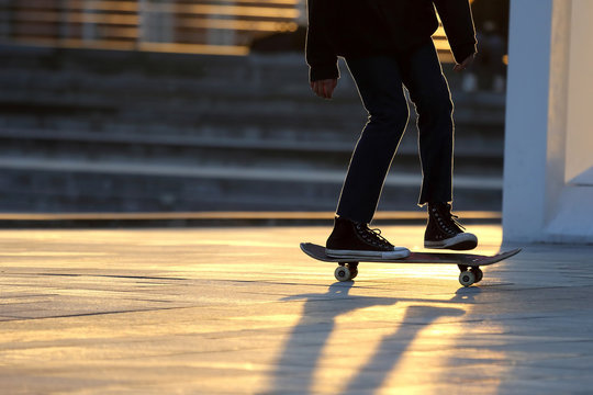 young people riding on a skateboard