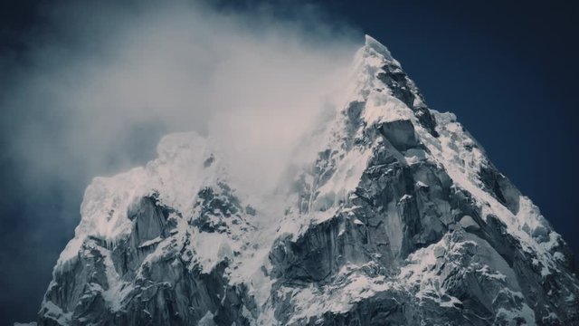 Wind blowing on the snowy peak of the Andean ridge, Alpamayo one of the most high of Peru. 4k