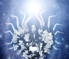 Many-armed female deity in the cosmos.