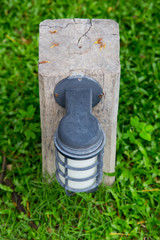 small lantern in a garden on the ground