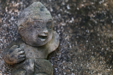 Fototapeta na wymiar Doll stucco smiling Placed on concrete background