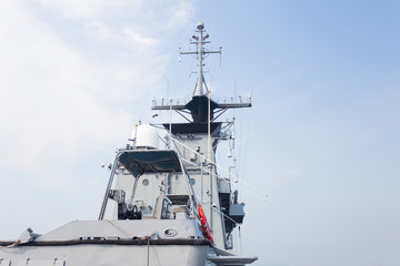 Naklejka premium Grey modern warship sailing in still water