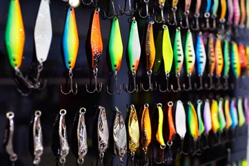 Meubelstickers Different colorful fishing baits on black © Sergey Ryzhov