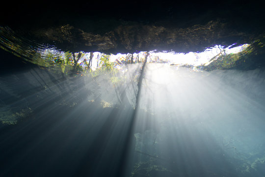 cenote sun light refraction mexico riviera maya yucatan