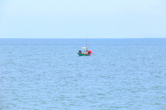 alone or single boat of fisherman on the sea or ocean.