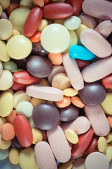 Vintage photo, Colorful medical pills and capsules as background, health care concept