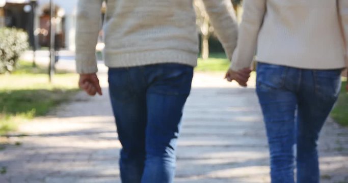 Young couple holding hands