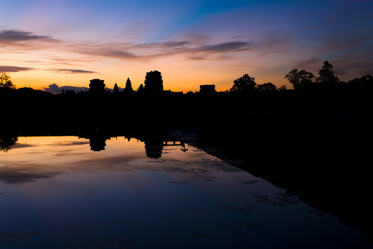 Angkor Wat Temple Silhouette Morning Sunrise Water Reflection in Cambodia