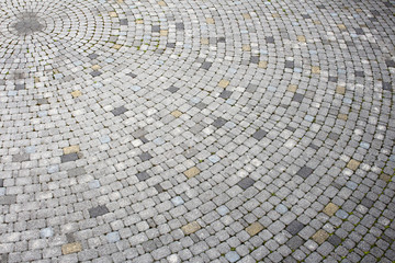 Fototapeta premium Fragment of stone surface, radial pattern of masonry, circular space