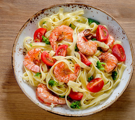 Pasta with shrimps and vegetables. Healthy diet  eating concept.