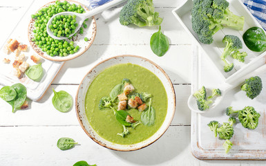 Green vegetables soup with croutons. Healthy eating.
