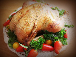 Roasted whole chicken on a plate