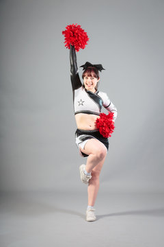 Studio Shot Of Cheerleader Posing
