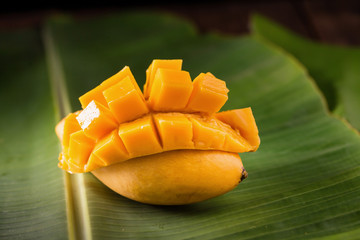 sweet mango on banana leaf.