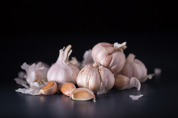 Garlic. Fresh Garlic. Cloves of garlic on black background.