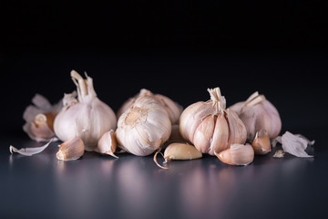Garlic. Fresh Garlic. Cloves of garlic on black background.