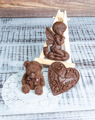gentle romantic valentine chocolate figures on cookie stand