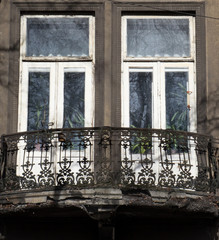 Balcony in the facade of the old house