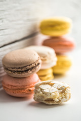 Colorful macaroons on wooden background