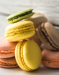 Colorful macaroons on wooden background