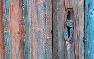 Old barn wall and rusted lock
